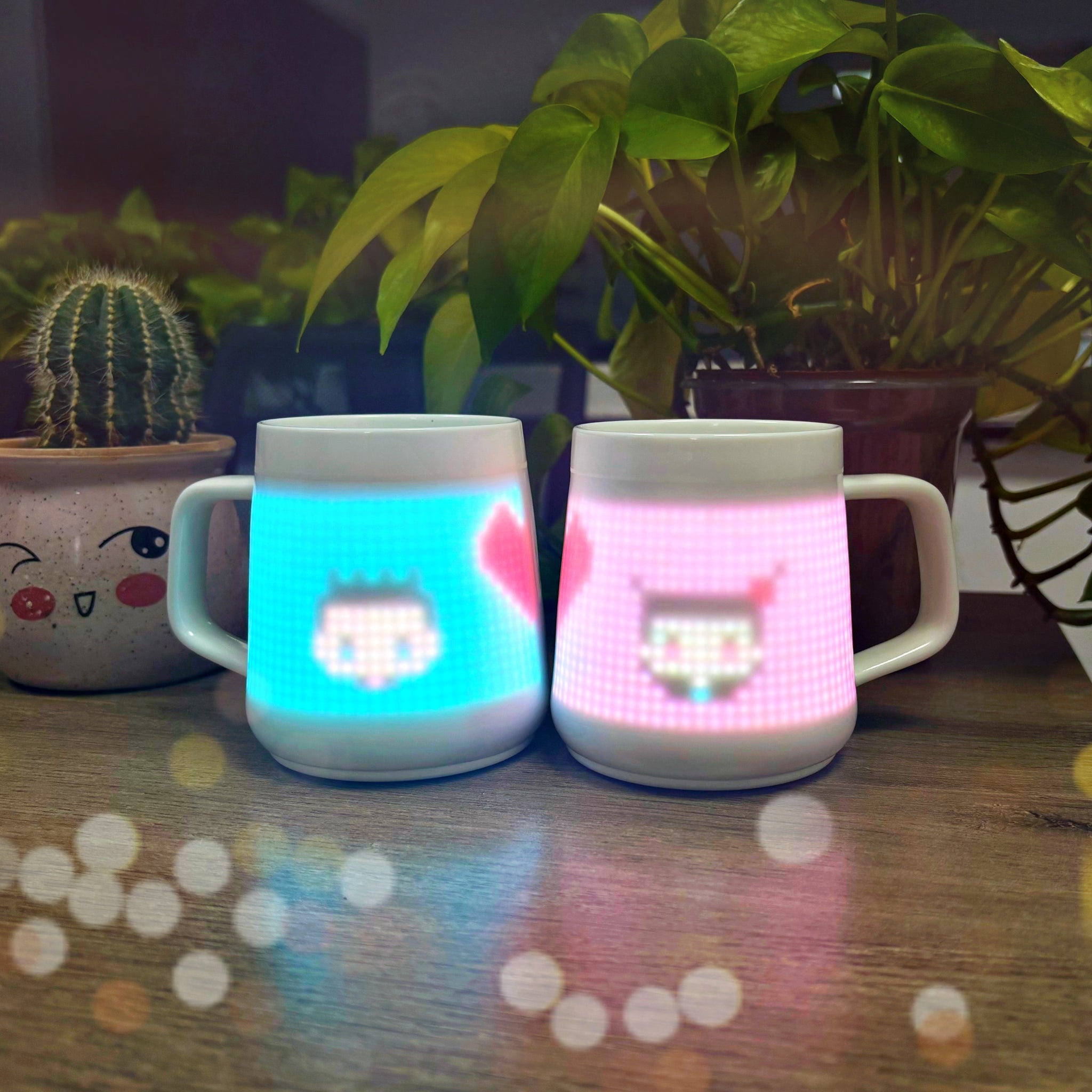 Pair of PixelMugs displaying couple-themed pixel art